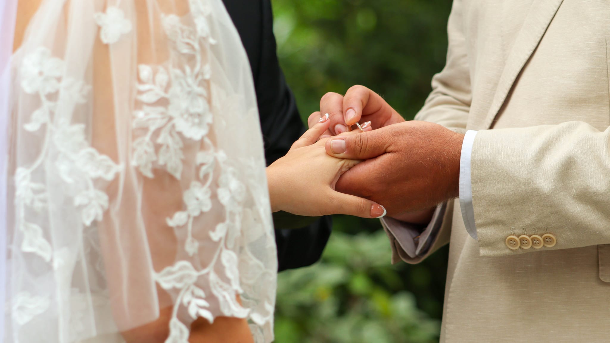 Ring being placed on hand
