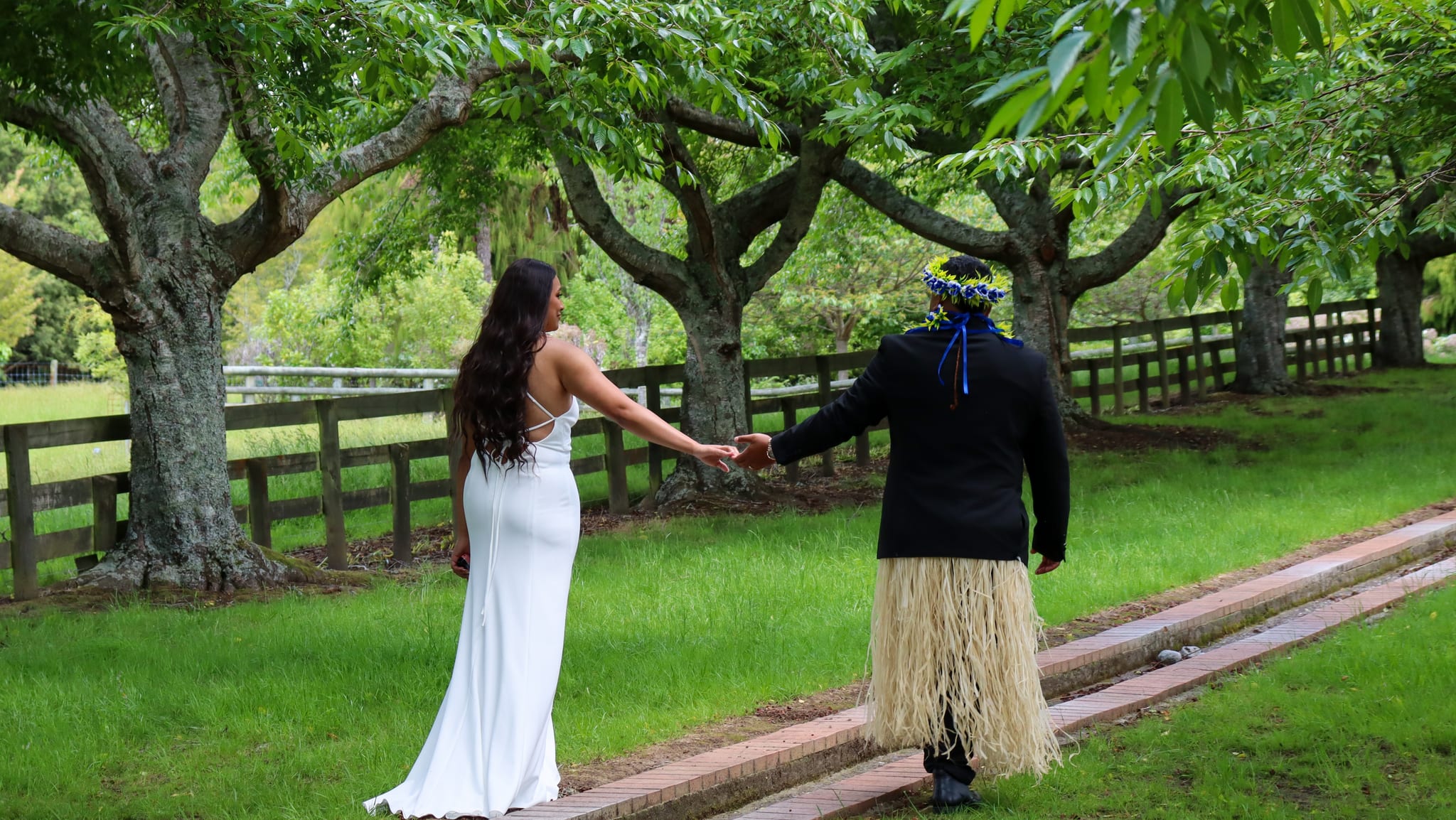 Bride and groom wlaking holding hands