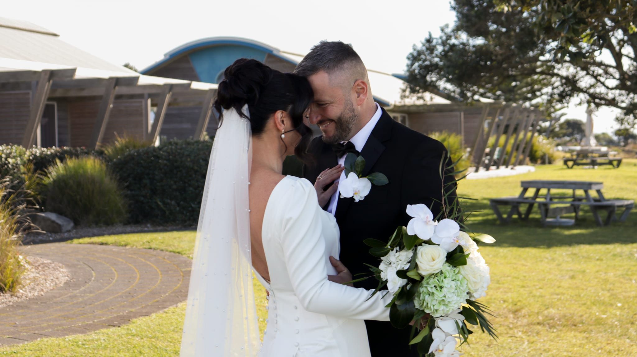 groom and wife touching forehead
